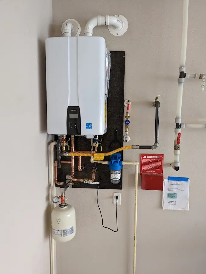 Professional plumber installing copper piping in a Old Fig Garden home